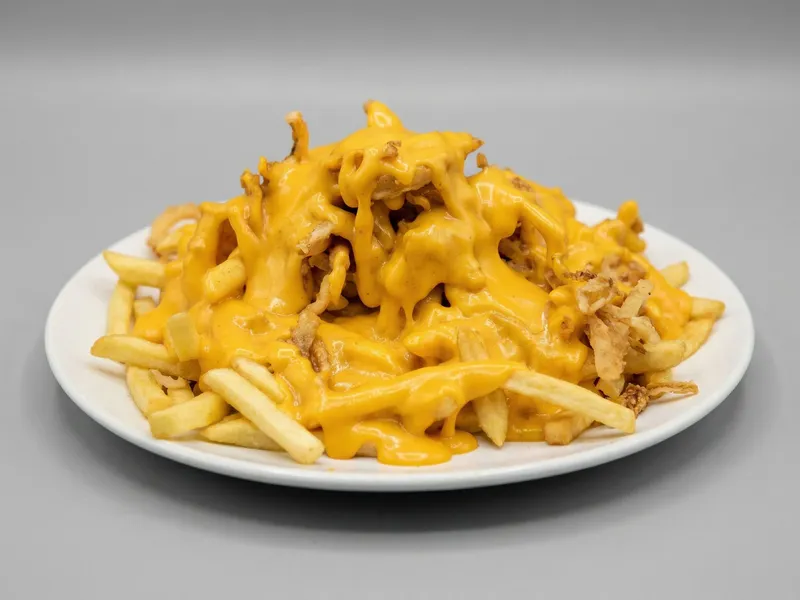 Papas Fritas con Cheddar y Cebolla Crispy