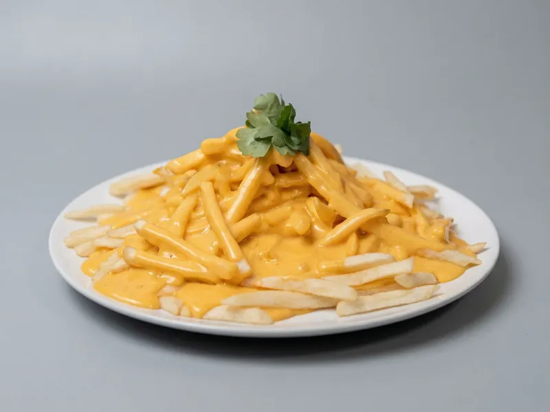 Papas Fritas con Crema Cheddar